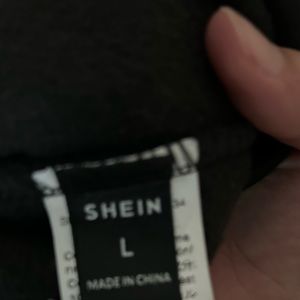 A Shein love never fails hoodie.